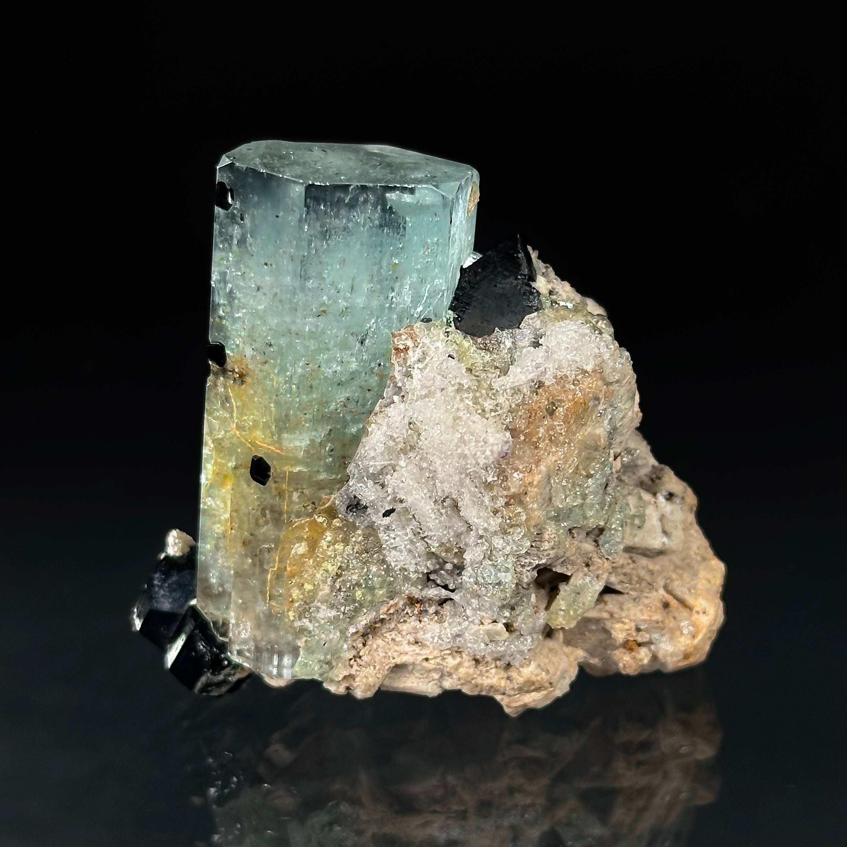 Beryl var. Aquamarine, Opal var. Hyalite, Schorl, on Feldspar