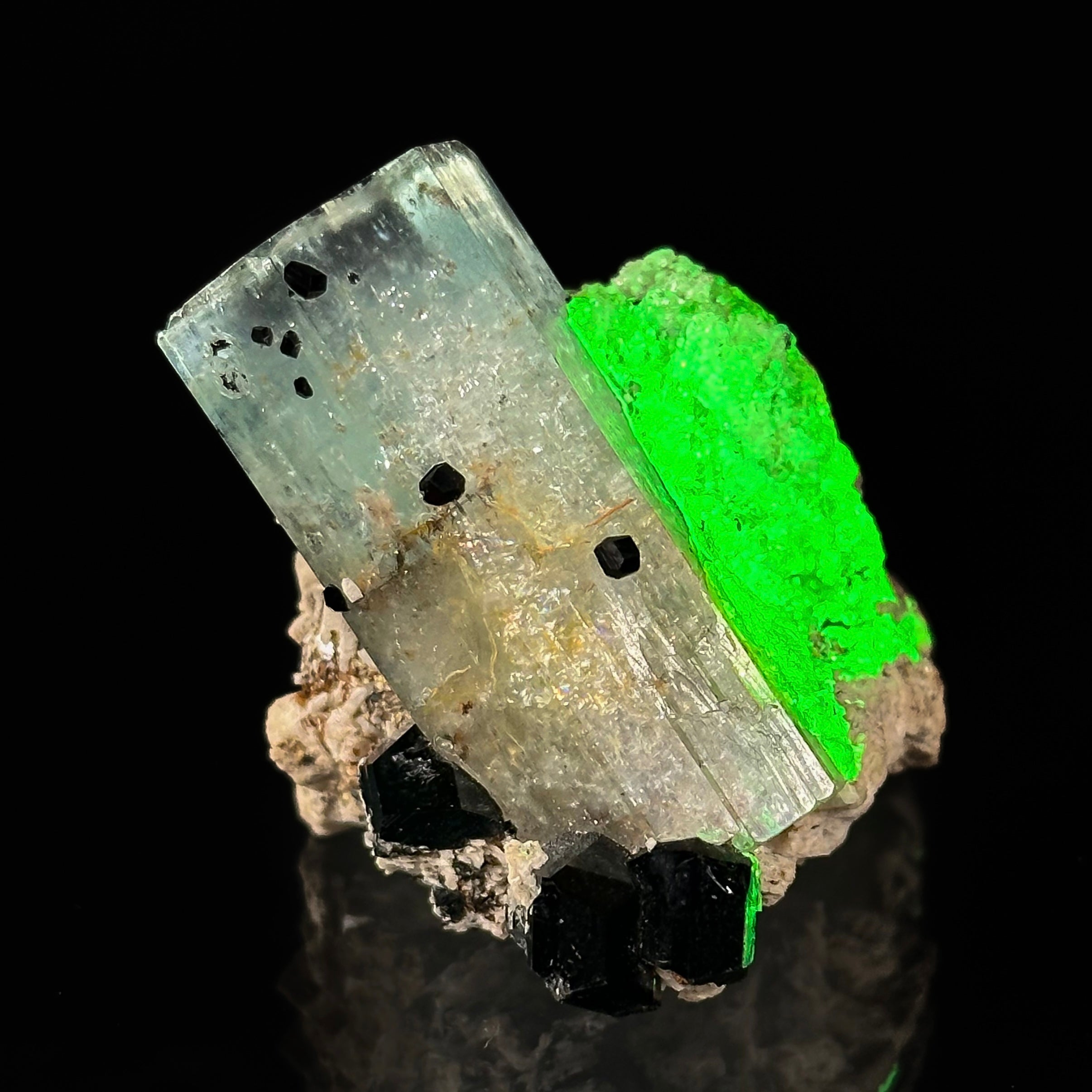 Beryl var. Aquamarine, Opal var. Hyalite, Schorl, on Feldspar