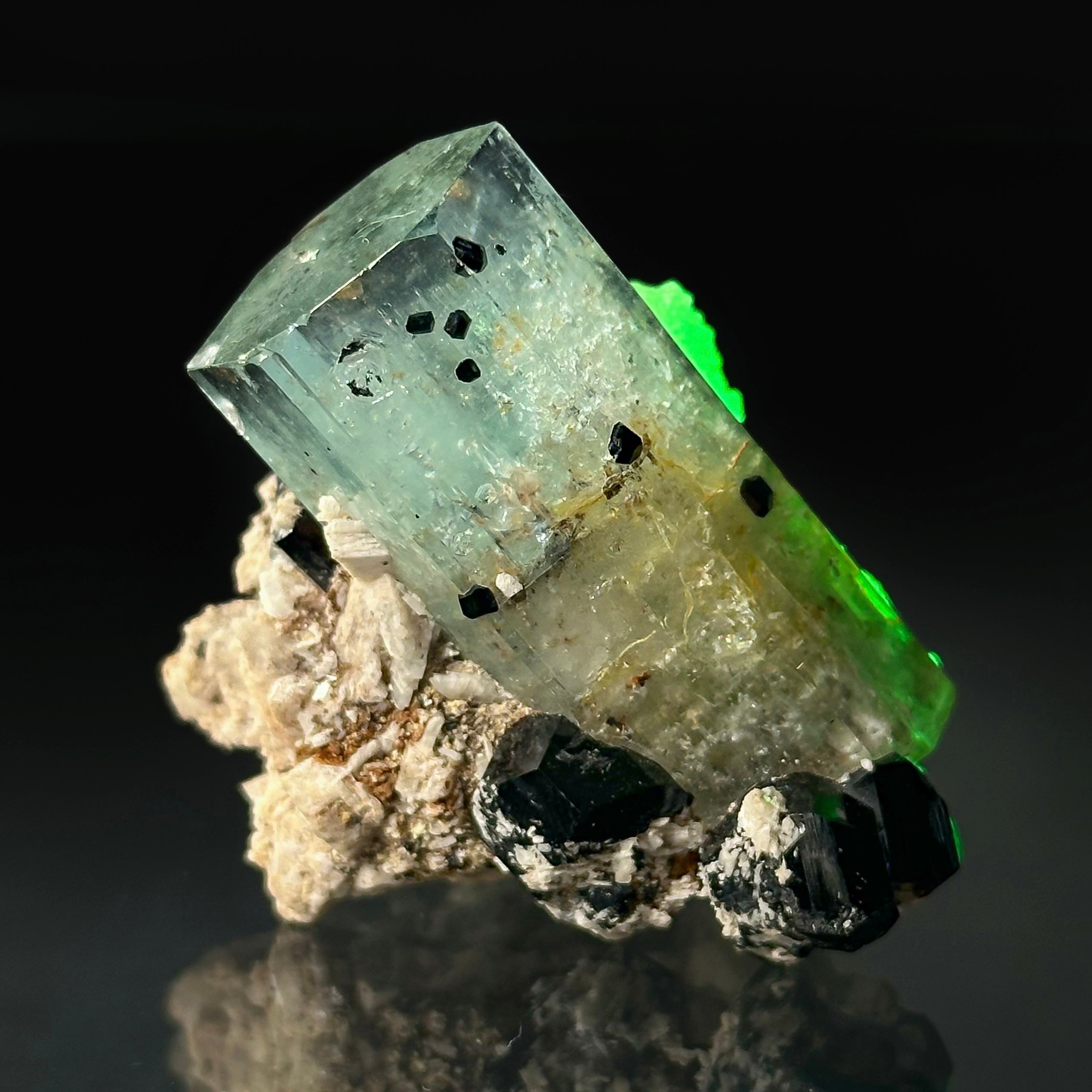 Beryl var. Aquamarine, Opal var. Hyalite, Schorl, on Feldspar